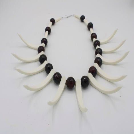 Lot - PNG NECKLACE WITH BOAR TEETH A/F