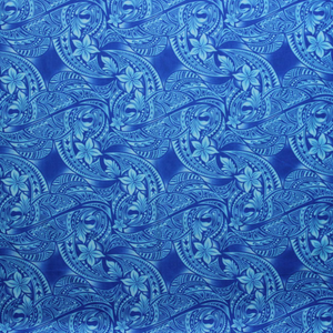 Close up of blue and lightblue Samoan tattoo design flowers and geometric patterns printed on 100% cotton fabric