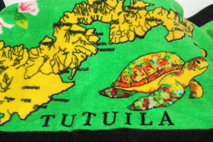 Tropical designs of the island of Tutuila and turtles on a green 100% cotton hand towel