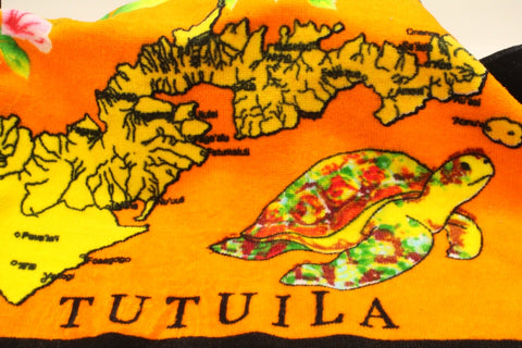 Tropical designs of the island of Tutuila and turtles on a orange 100% cotton hand towel