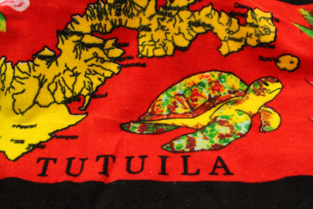 Tropical designs of the island of Tutuila and turtles on a red 100% cotton hand towel