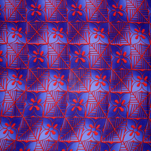 Blue and purple Samoan tattoo and flower design in symmetrical pattern on quick-dry polyester fabric.